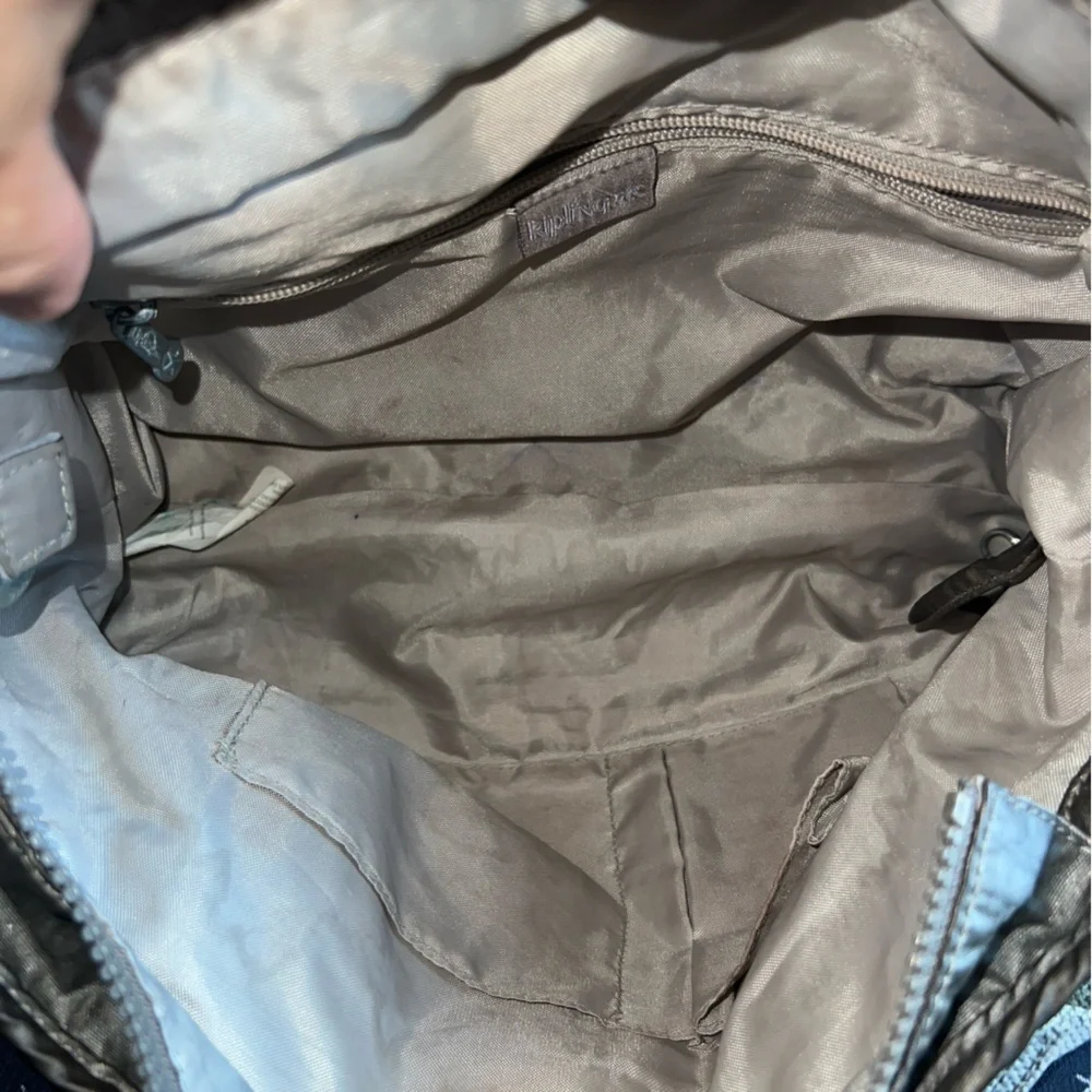 Kipling Angela medium shoulder bag Stylish Metallic with furry monkey Mary